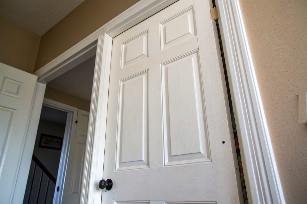An interior door with a tapered gap along its frame